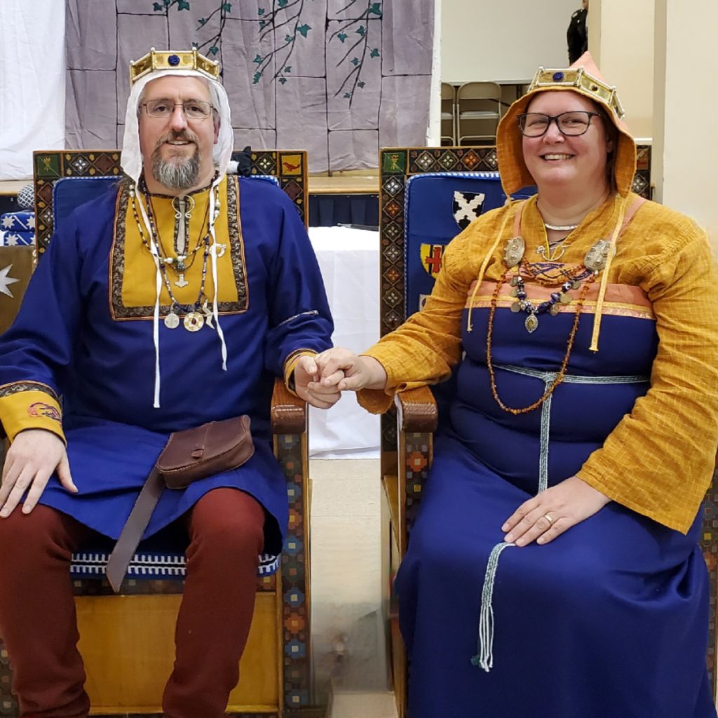 Vémundr Syvursson and Hallveig Sigrúnardóttir sitting on the thrones of Seagirt on the day of their elevation to Baron and Baroness.